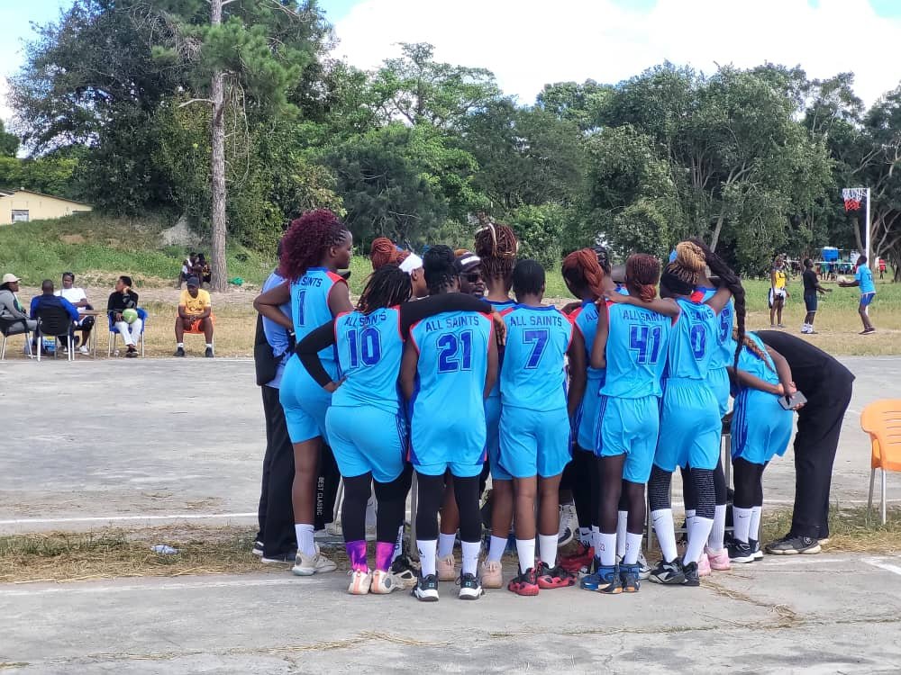 Basketball team huddled together